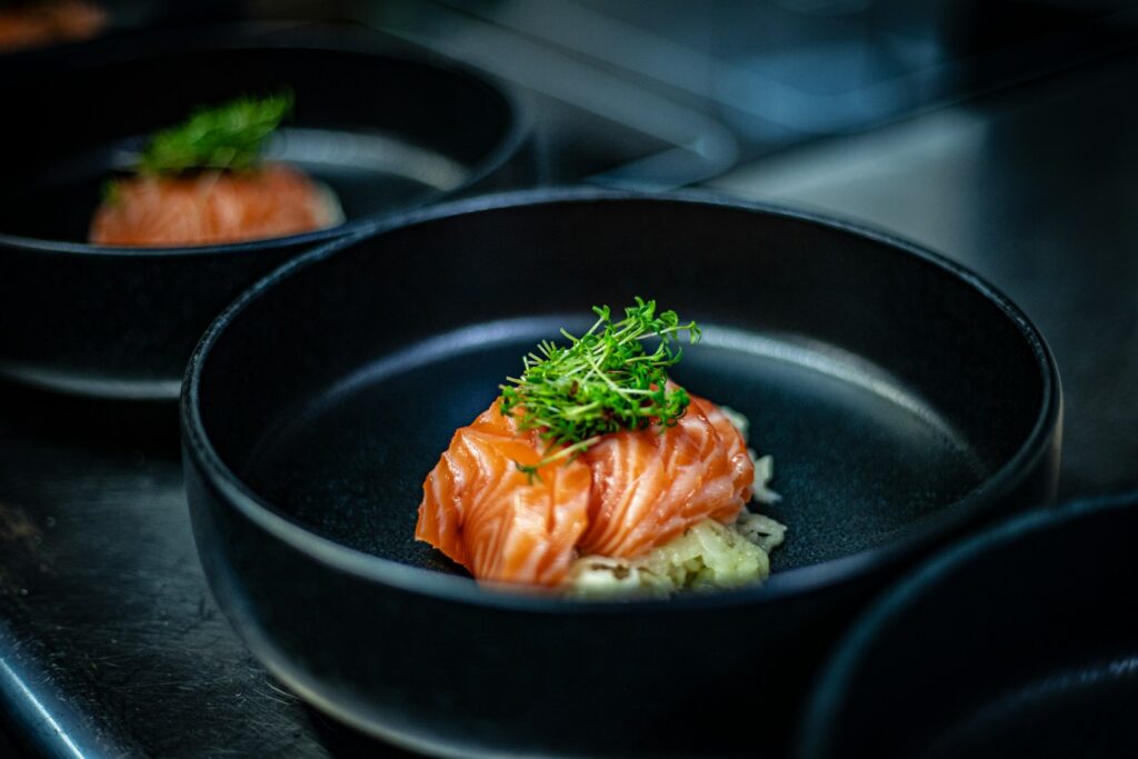 a black plate with some food in it